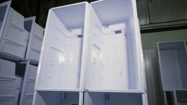 Stacks of inner cases for domestic fridges in plant storage — Stock Video