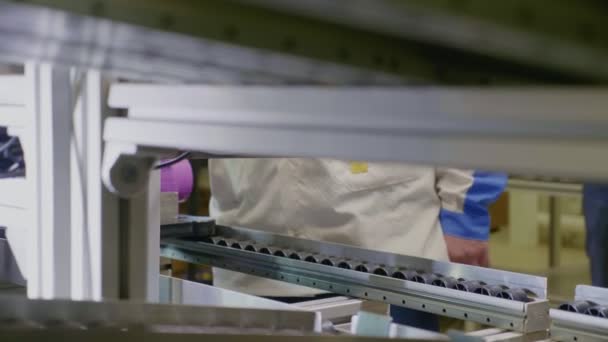 Worker operates with pink body of meter at workplace closeup — Stock Video