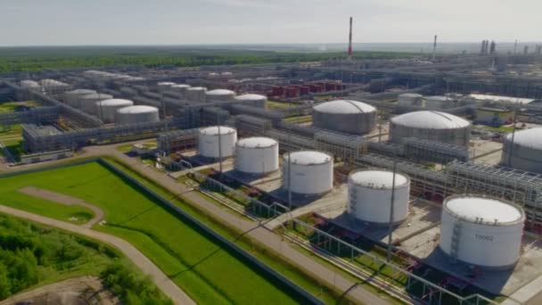 Rows of huge white gas tanks at refinery plant aerial view — Stock Video