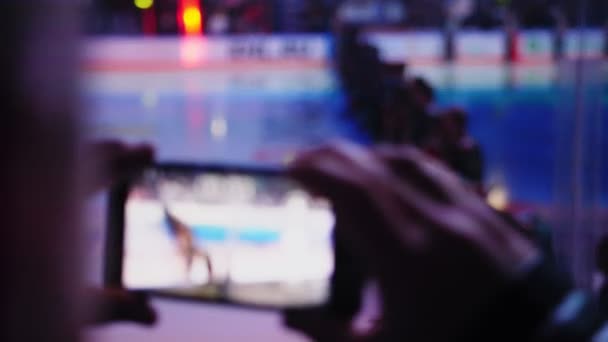 Sports fan shoots line of hockey players standing on arena — Stock Video