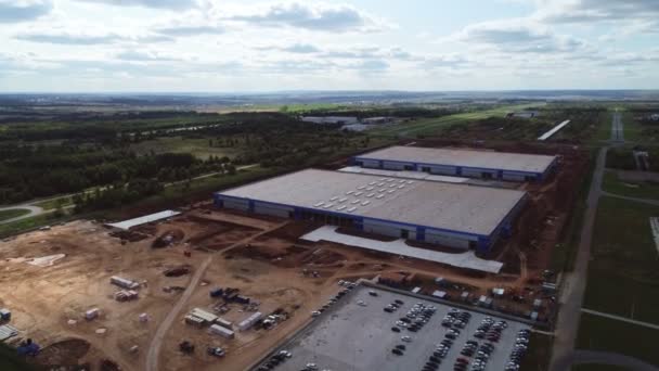 Production complex with future warehouses against fields — Stock Footage Production complex with future warehouses against fields Royalty Free Stock Video