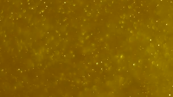 啤酒泡沫 金色的灰尘 金色颗粒尘埃 动画背景 — 图库视频影像