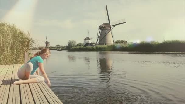Cheerful Girl Tourist Splashing River Beautiful Landscape Backgorund Old Windmills — Stock Video