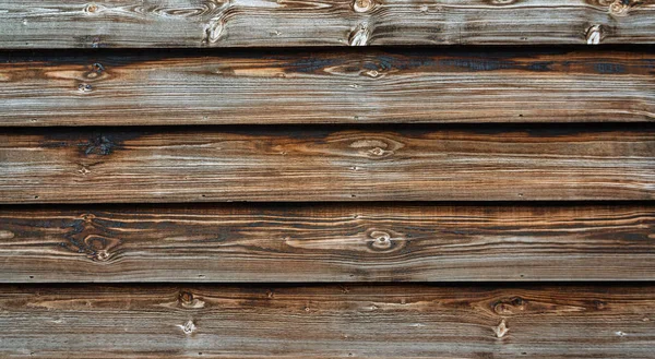Textura de una vieja pared oscura sin pintar de tableros de madera —  Fotos de Stock