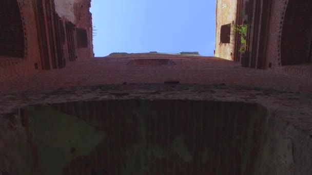 Exit from the middle out of the old Catholic church with a ruined roof — Stock Video