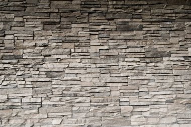 Modern tarz dekoratif desenli gri desen çatlamış gerçek taş duvar yüzeyi çimentoyla