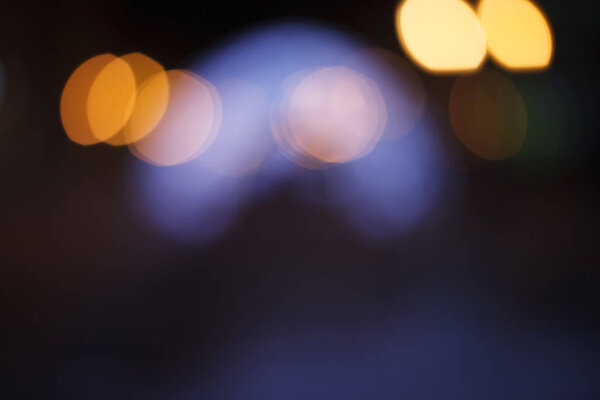 Night walk around the city. Decoration of streets with garlands and lanterns. Night city photo bokeh.