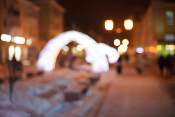 Night walk around the city. Decoration of streets with garlands and lanterns. — Stock Photo, Image