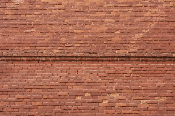 붉은 벽돌 벽의 질감 이 격자 모양의 모서리로 배경을 흔들어 놓는다, — 스톡 사진