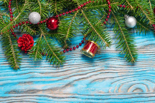 Red Christmas Decorations Fir Branch Blue Wooden Background — Stock Photo, Image