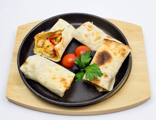 Arabian dough, wrapped chicken with decoration of tomato and lettuce, traditional dish, restaurant, specialties, kitchen, chef, served