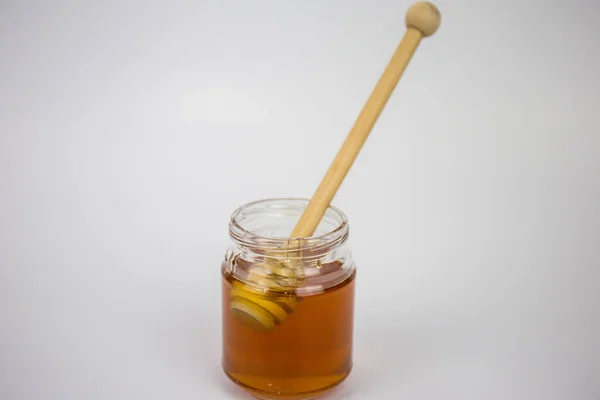 Glass Jar Honey Wooden Stick White Background — Stock Photo, Image