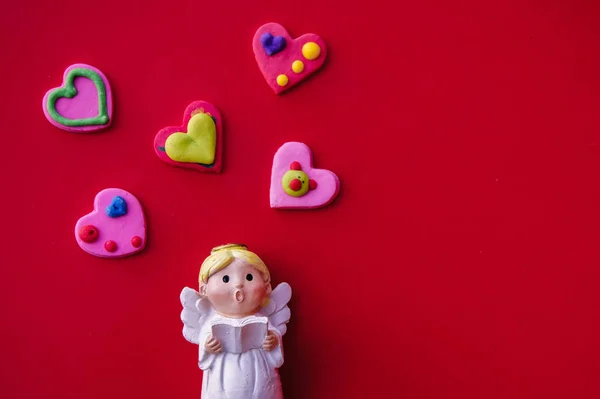 Cupid Doll Heart Shaped Red Background — Stock Photo, Image