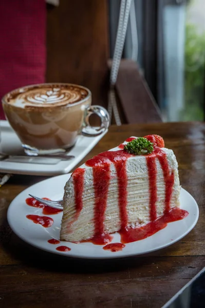 Strawberry crape cake on wood table in coffee shop , dessert tas — Stock Image Strawberry crape cake on wood table in coffee shop , dessert tas Stock Image