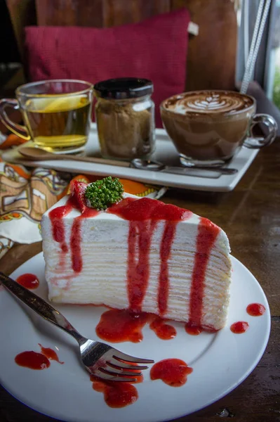 Strawberry crape cake on wood table in coffee shop , dessert tas — Stock Image Strawberry crape cake on wood table in coffee shop , dessert tas Royalty Free Stock Images
