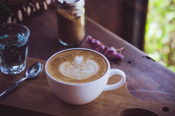 Coffee latte white cup on wood table in cafe coffee shop in the — Stock Photo, Image