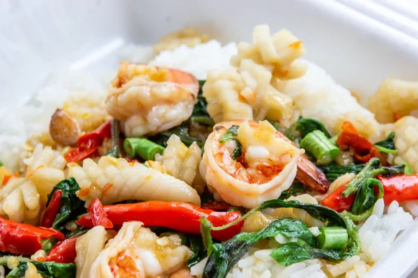 Fried basil shrimp with squid topped with rice — Stock Photo, Image