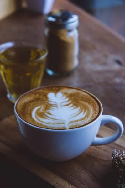 Coffee hot drink cappucino latte art on wood vintage table , cof — Stock Photo, Image