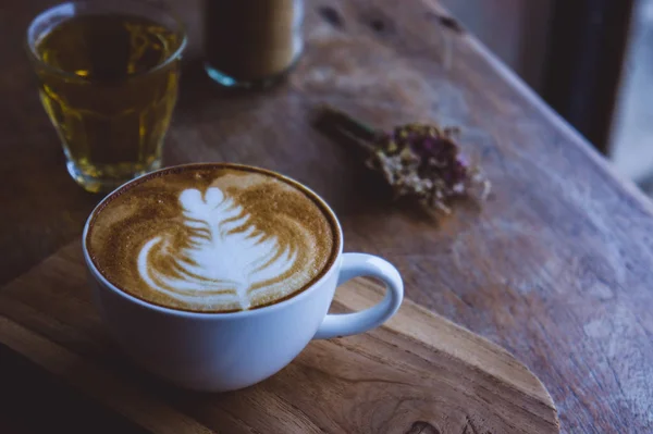 Coffee hot drink cappucino latte art on wood vintage table , cof — Stock Photo, Image