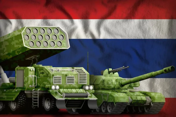 tank and rocket artillery with summer pixel camouflage on the Thailand flag background. Thailand heavy military armored vehicles concept. 3d Illustration