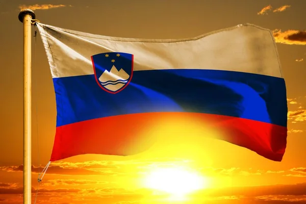 Slovenia flag weaving on the beautiful orange sunset background