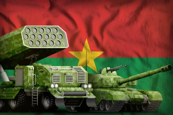 tank and rocket artillery with summer pixel camouflage on the Burkina Faso flag background. Burkina Faso heavy military armored vehicles concept. 3d Illustration