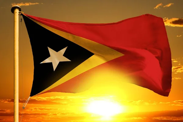 Timor Leste Flaggenweberei Auf Dem Wunderschönen Orangefarbenen Hintergrund Des Sonnenuntergangs — Stockfoto