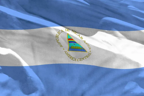 Zwaaien vlag van Nicaragua voor het gebruik van textuur als achtergrond, is de vlag wapperen op de wind — Stockfoto