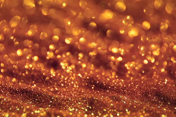 Goldglänzender Sand aus Glitzern - Festival-Konzept mit Bokeh-Textur - niedlicher abstrakter Fotohintergrund — Stockfoto