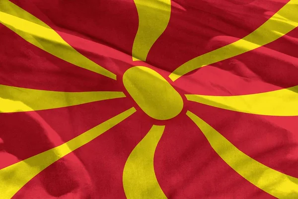 Розмахуючи Македонія прапор для використання як текстуру або фону, прапор майоріли на вітер — стокове фото