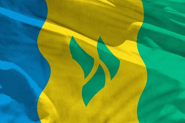 Schwenkt Saint Vincent und die Grenadinen-Flagge zur Verwendung als Textur oder Hintergrund, die Flagge flattert im Wind — Stockfoto