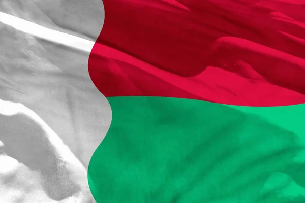 Waving Madagascar flag for using as texture or background, the flag is fluttering on the wind