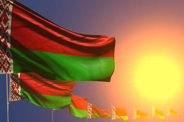 Assez nombreux drapeaux de Biélorussie sur le coucher du soleil placé en diagonale avec bokeh et espace pour le contenu - toute occasion drapeau illustration 3D — Photo