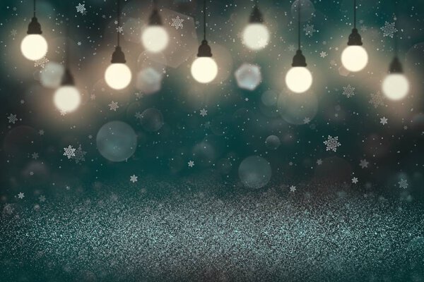 light blue nice brilliant glitter lights defocused bokeh abstract background with light bulbs and falling snow flakes fly, festal mockup texture with blank space for your content