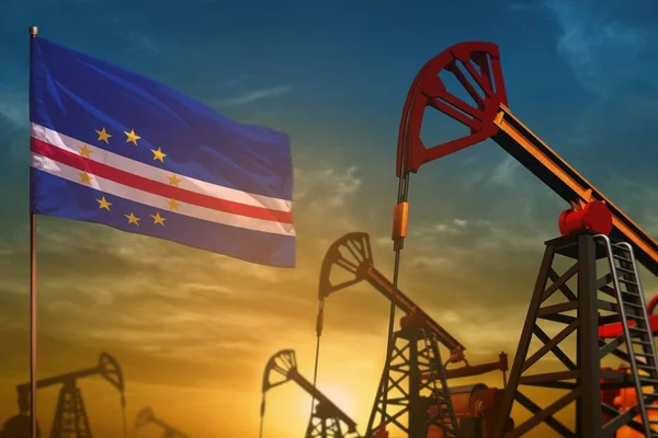 Концепция нефтяной промышленности Кабо-Верде. Промышленная иллюстрация - флаг Кабо-Верде и нефтяные скважины на фоне синего и желтого неба на закате - 3D иллюстрация — стоковое фото
