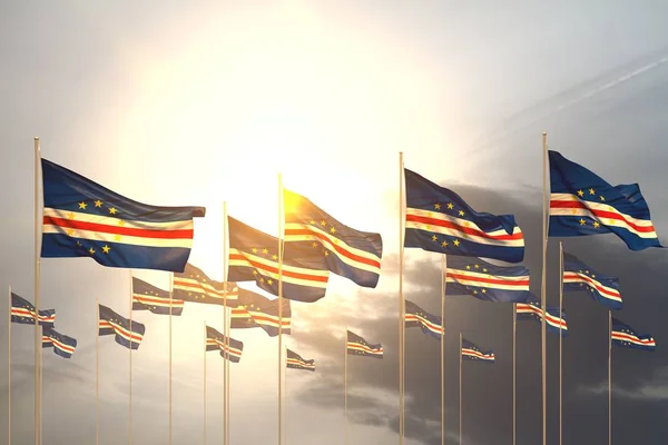 Bon nombre de drapeaux Cabo Verde dans une rangée sur le coucher du soleil avec place libre pour votre texte - toute occasion drapeau illustration 3d — Photo