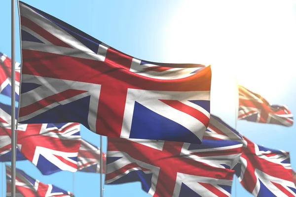 Cute many United Kingdom (UK) flags are wave against blue sky photo with soft focus - any celebration flag 3d illustration — Stock Photo, Image