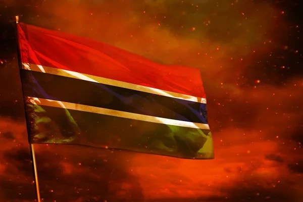 Vlajka Gambie na karmínově rudé obloze s kouřovým pilířem. Koncepce problémů. — Stock fotografie