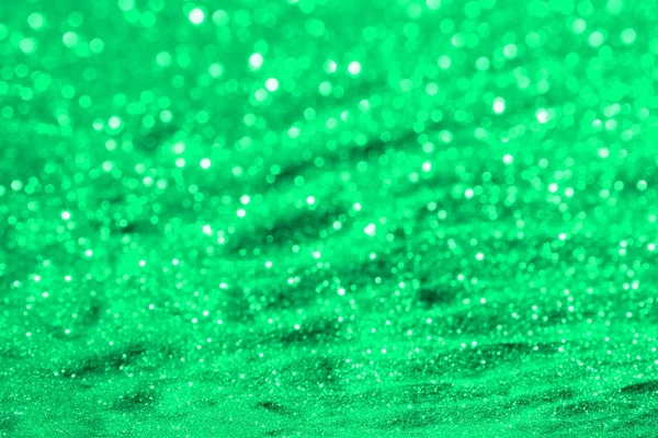 Sarcelle, mer-vert sable métallique brillant fait de paillettes - concept lumineux avec texture bokeh - fantastique fond photo abstrait — Photo