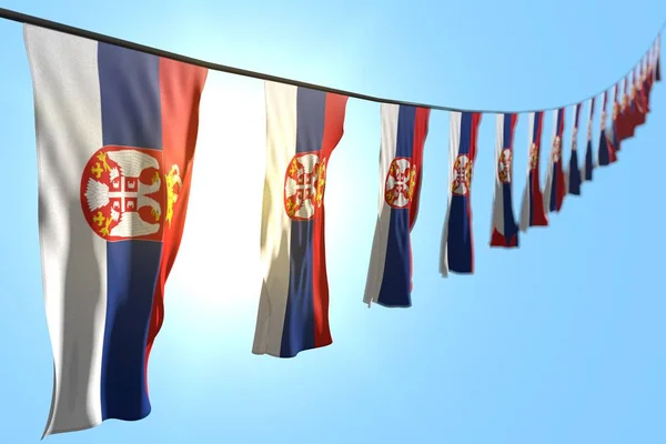 Schön viele serbien-fahnen oder banner hängen diagonal auf seil auf blauem himmel hintergrund mit weichem fokus - jede gelegenheit flagge 3d illustration — Stockfoto