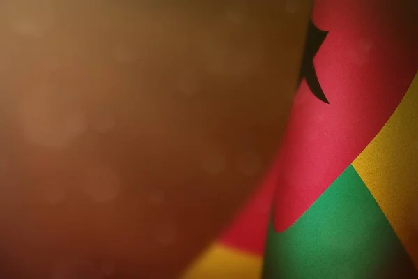 Guinea-Bissau Flagge zu Ehren des Veteranen- oder Gedenktages. Ruhm für die Guinea-Bissau-Helden des Kriegskonzepts auf orangefarbenem, dunklem Samtgrund. — Stockfoto