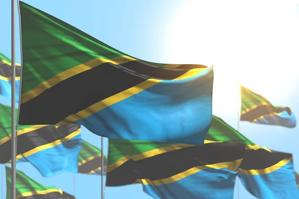 Lindo muchas banderas de Tanzania ondean contra la ilustración del cielo azul con enfoque suave - cualquier ocasión bandera 3d ilustración — Foto de Stock