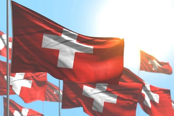 Nice många Schweiz flaggor är våg mot blå himmel bild med bokeh-någon fest flagga 3D-illustration — Stockfoto