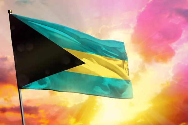 Fluttering Bahamas flag on beautiful colorful sunset or sunrise background. Success concept. — Stock Photo, Image