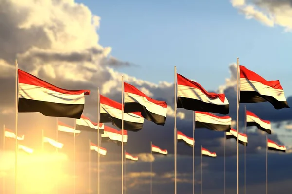 Ziemlich viele jemenitische Flaggen bei Sonnenuntergang in einer Reihe mit weichem Fokus und Platz für Inhalte platziert - jede Gelegenheit Flagge 3d Illustration — Stockfoto