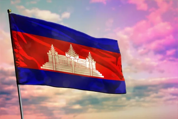 Ondeando la bandera de Camboya sobre un colorido fondo nublado. Concepto de prosperidad . —  Fotos de Stock