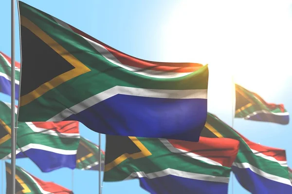 Belas muitas bandeiras da África do Sul estão acenando contra a ilustração do céu azul com foco suave qualquer bandeira celebração ilustração 3d — Fotografia de Stock