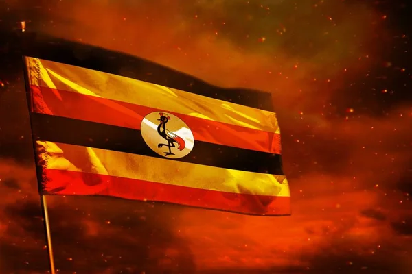 Fluttering Uganda bandeira no céu vermelho carmesim com fundo pilares de fumaça. Conceito de problemas . — Fotografia de Stock