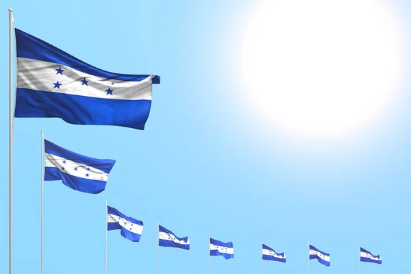 nice many Honduras flags placed diagonal on blue sky with place for your content - any celebration flag 3d illustration
