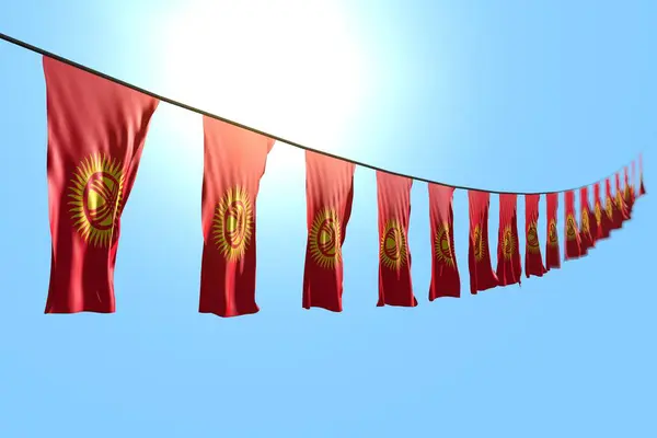Bello molte bandiere Kirghizistan o striscioni appesi diagonale su corda su sfondo cielo blu con bokeh - qualsiasi bandiera festa 3d illustrazione — Foto Stock